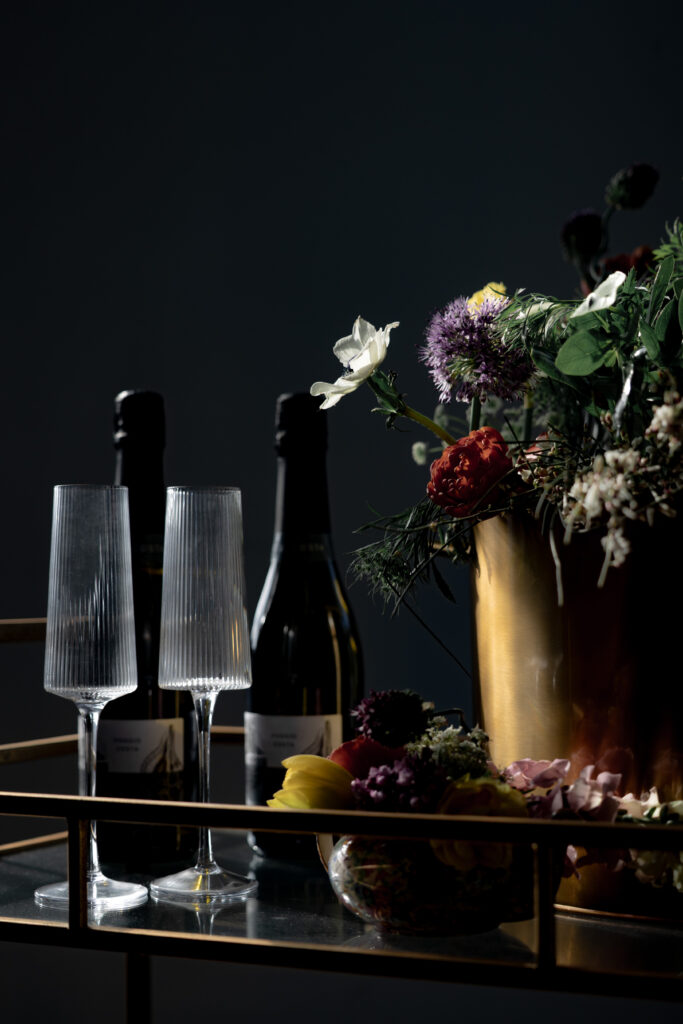 Champagne cart outlined in sunshine with gold and floral details.