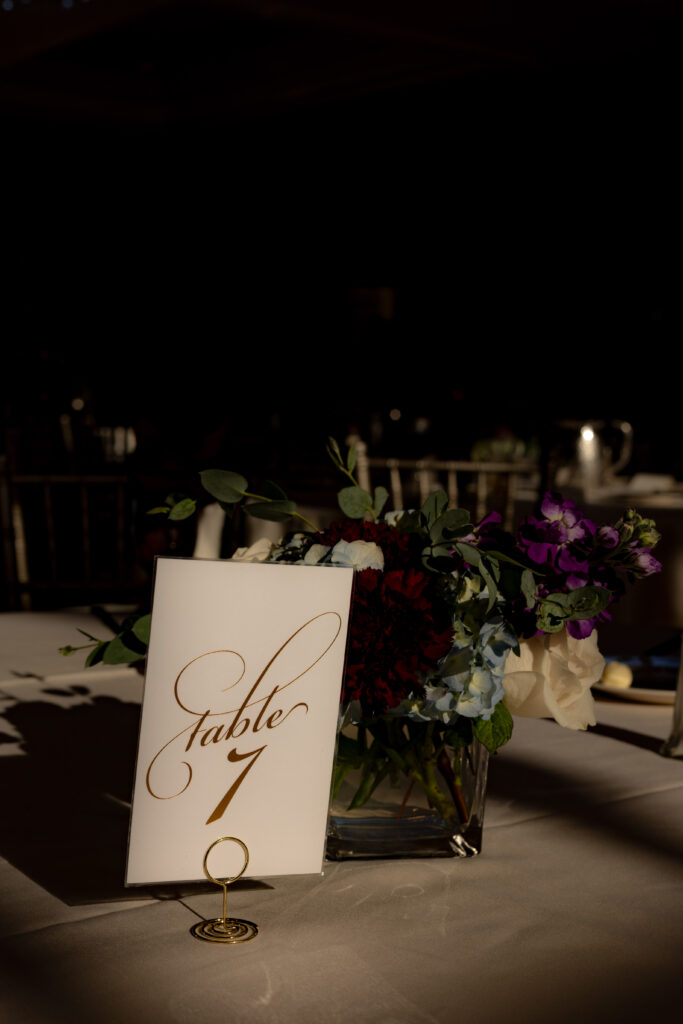 Simple and elegant wedding table decor lit by beautiful window light.
