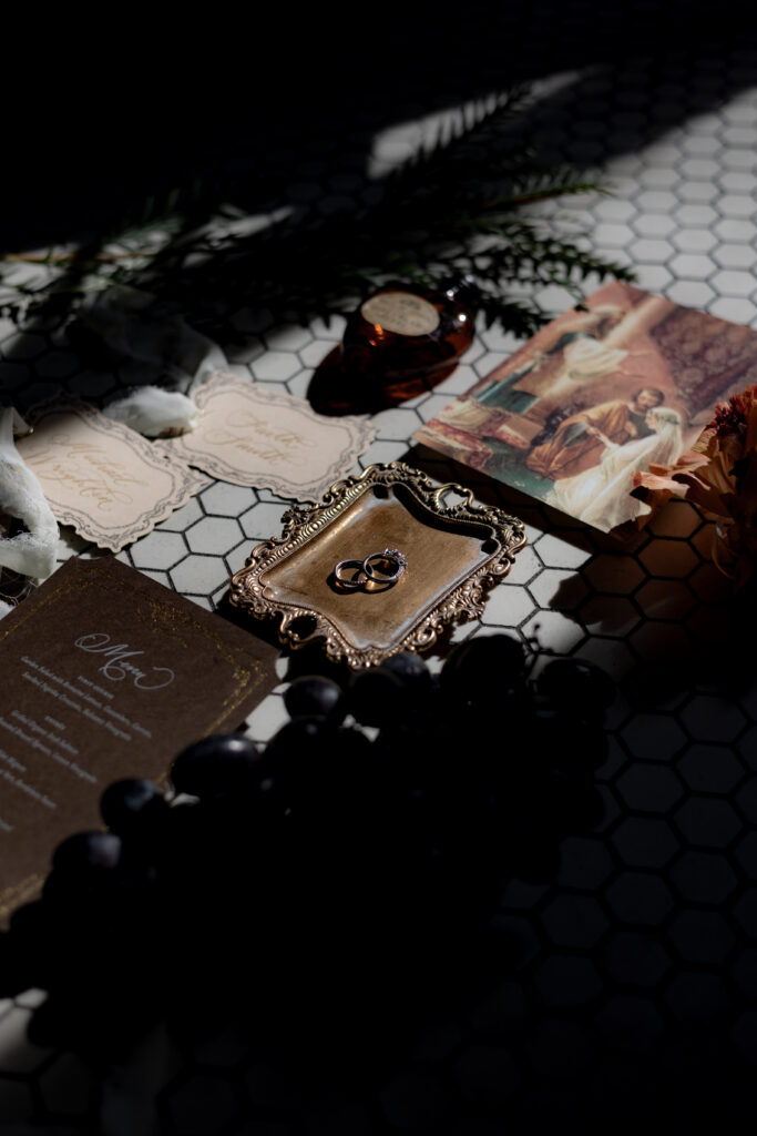 A rich and moody flatlay on tile that centers on the beauty of simple elegance in your details.