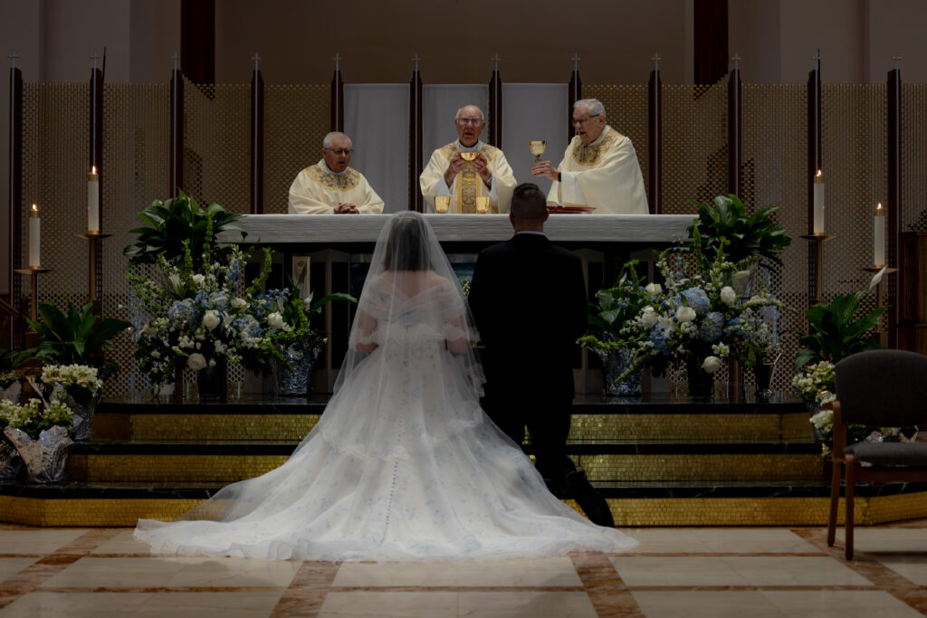 Bride and Groom worshipping during the Eucharistic Prayer of their Novus Ordo Wedding Mass