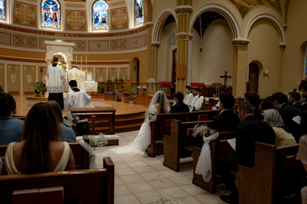 Bride and groom celebrate their beautiful TLM Mass at stunning St. Thomas the Apostle Catholic Church in Ann Arbor, MI