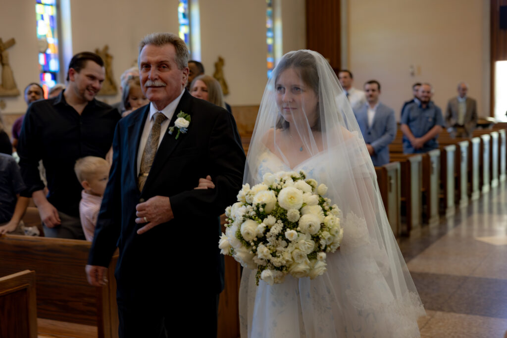 Bride and her father process down the aisle of St. Monica's Catholic Church in Garfield Heights, OH.
