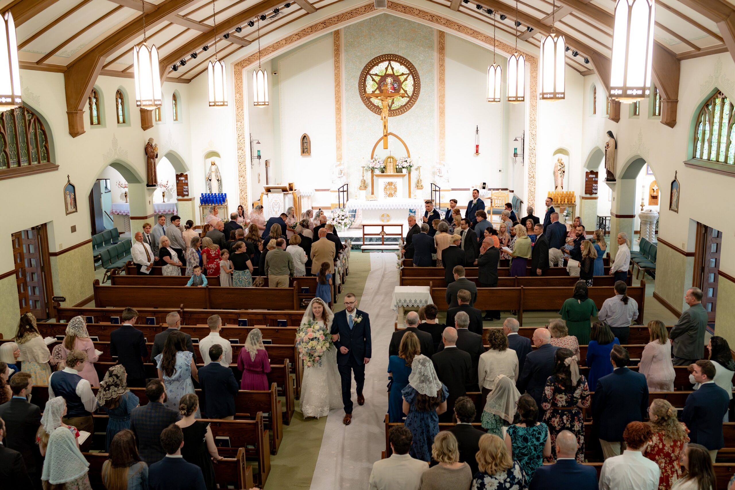 Bride and Groom recess down the aisle at St. Joseph Catholic Church in Cuyahoga Falls, Ohio
