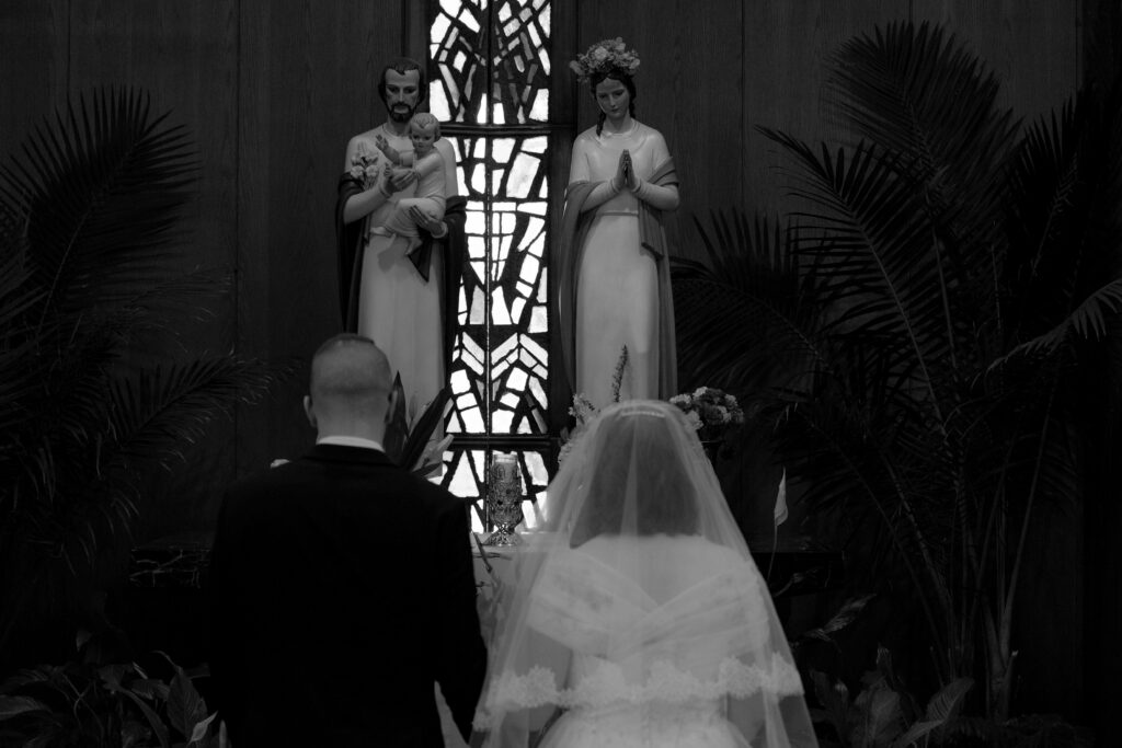 Catholic Bride and Groom honor the Holy Family during their Catholic Wedding Mass at St. Monica Catholic Church in Cleveland, OH.