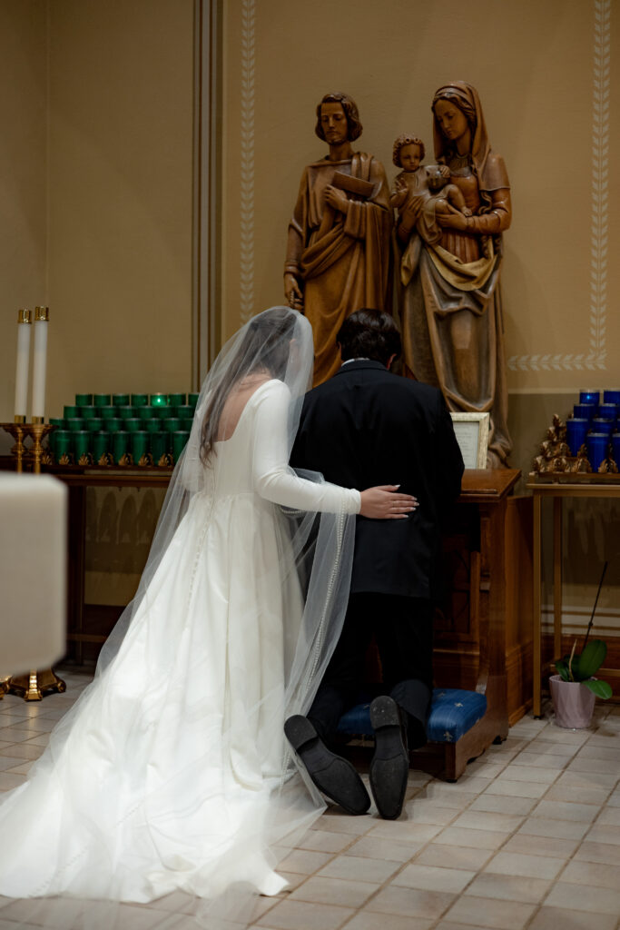Bride and Groom honor the Holy Family during their Traditional Latin Mass at St. Thomas the Apostle in Ann Arbor, Michigan.