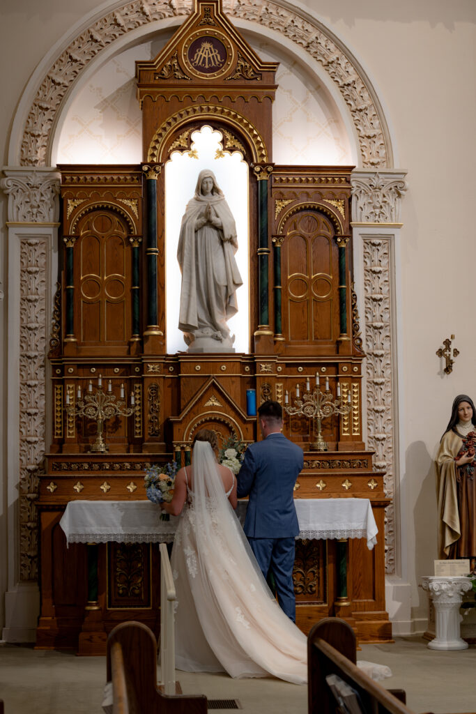 Bride and Groom honor Mary during their Catholic Wedding Mass at St. Mary's Catholic Church in Tiffin, OH.